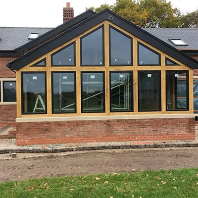 A brick building with a large glass window.