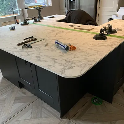 A kitchen counter with tools on top of it.