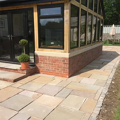 A brick building with a glass front door.